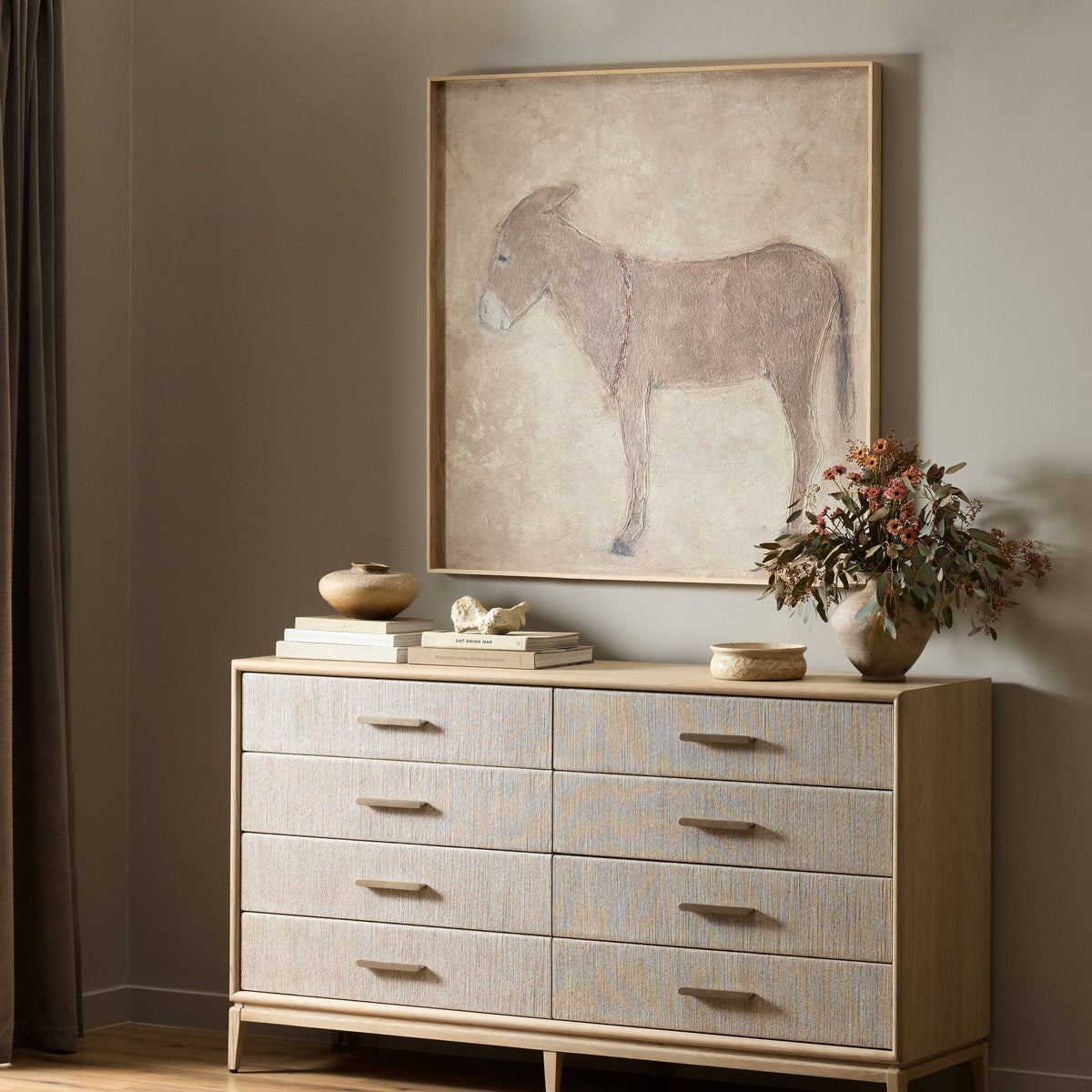 a painting on a dresser