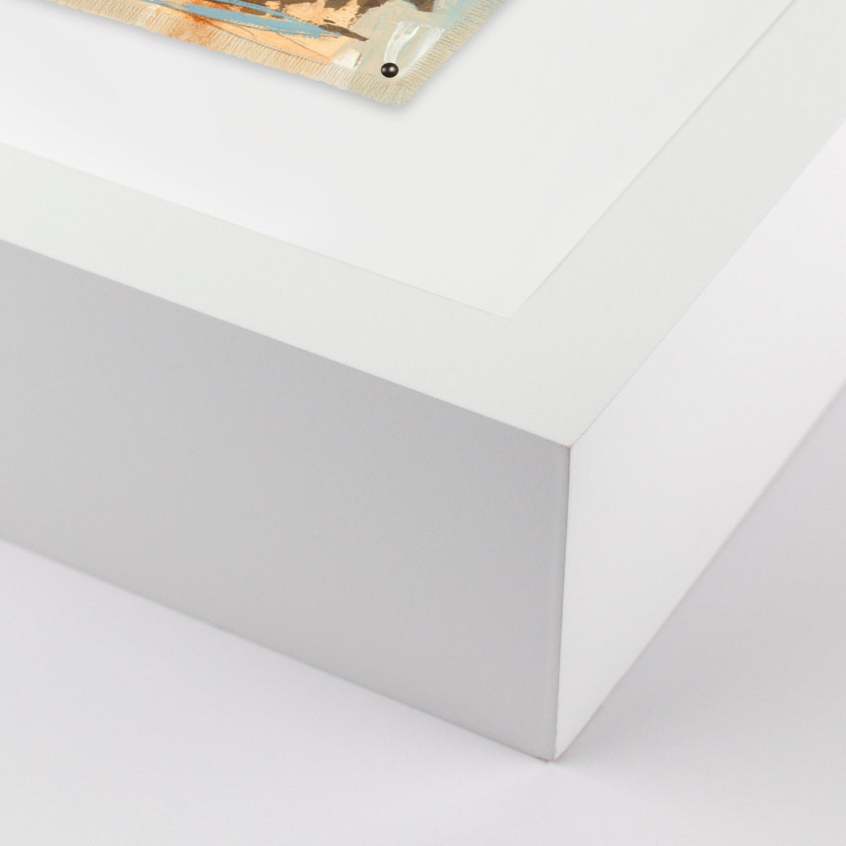 a white surface with a piece of paper on it