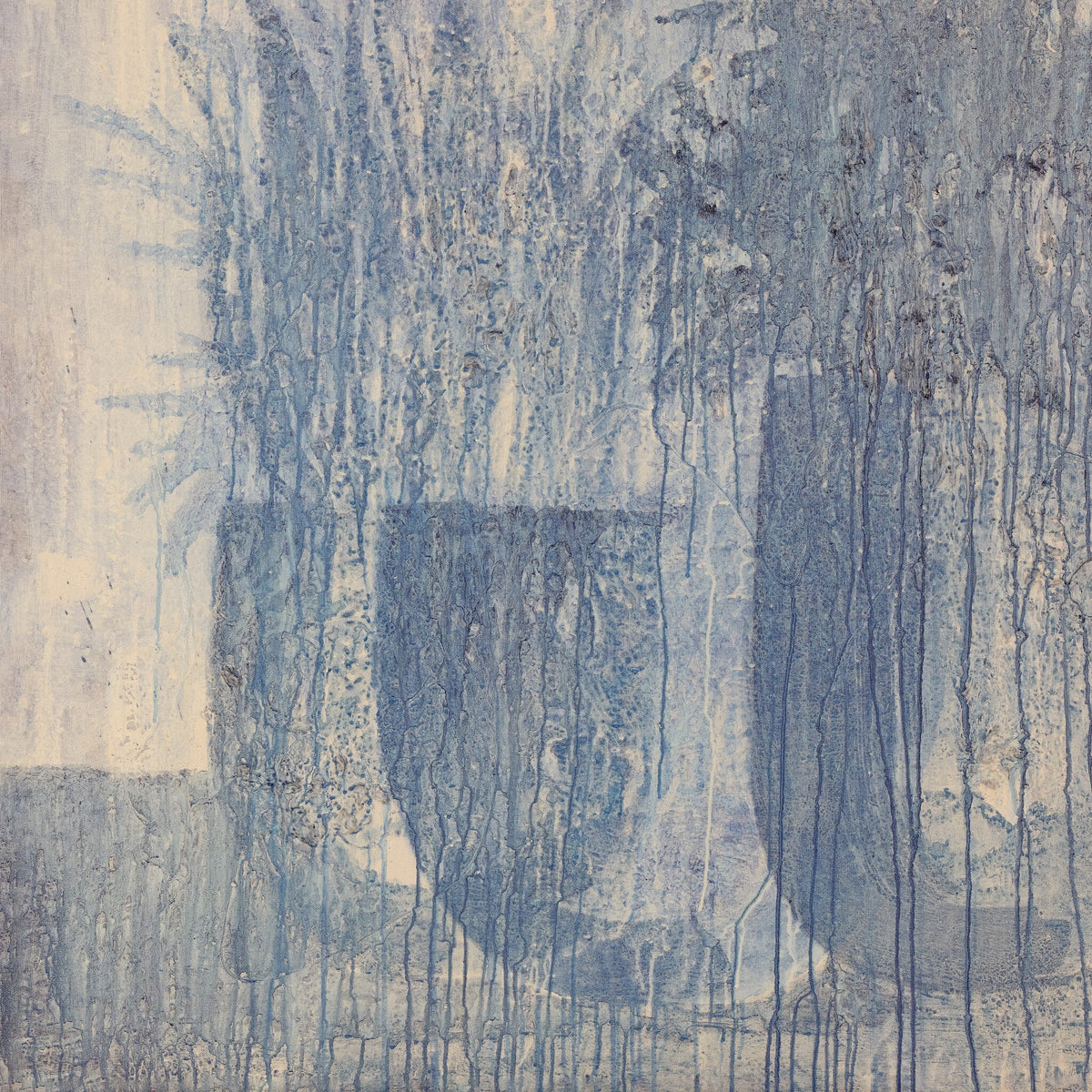a blue and white wall with a letter u