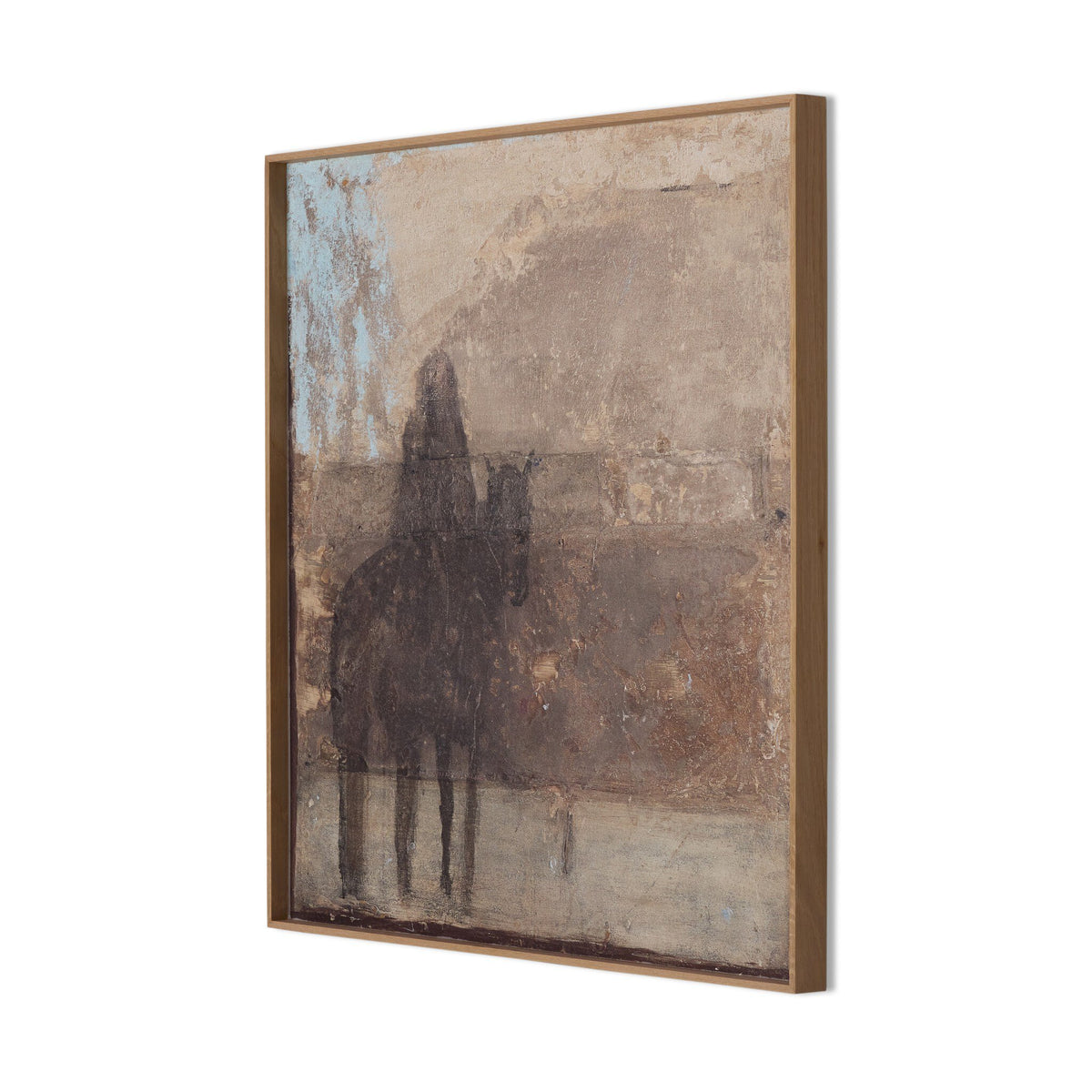 a framed picture of a person on a camel