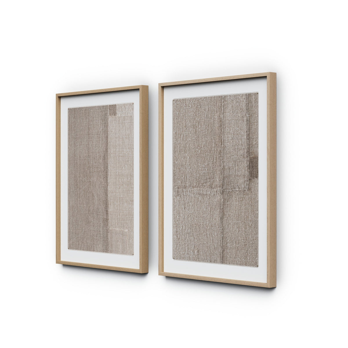 a two framed pictures on a white wall