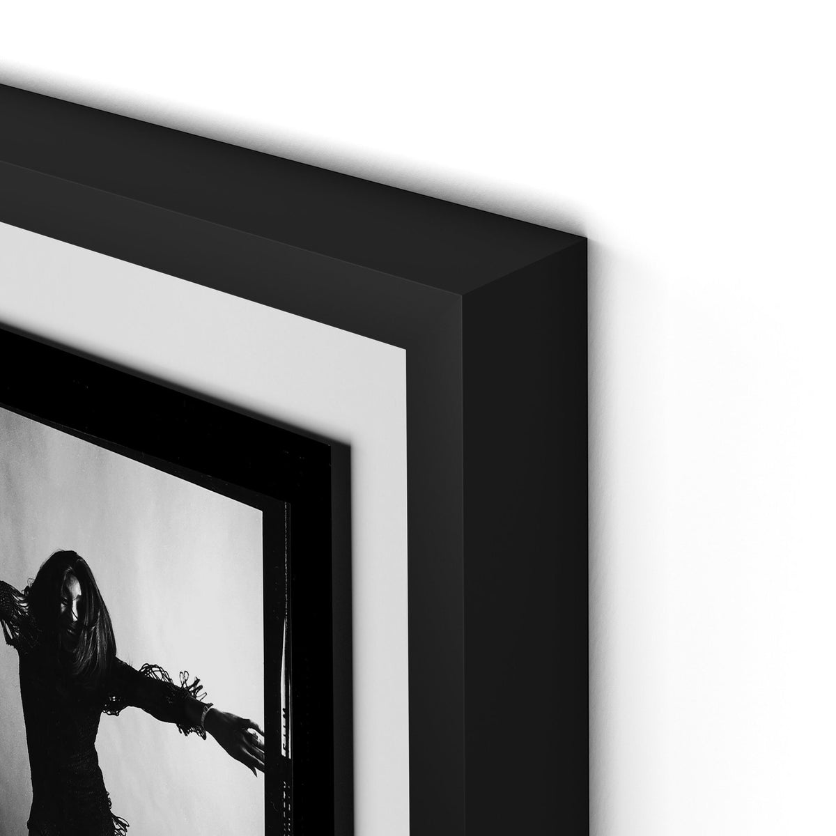 a framed picture of a person in a black frame