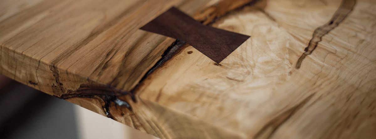 a piece of wood with a square in center