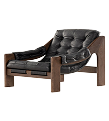 a black leather chair with wooden legs