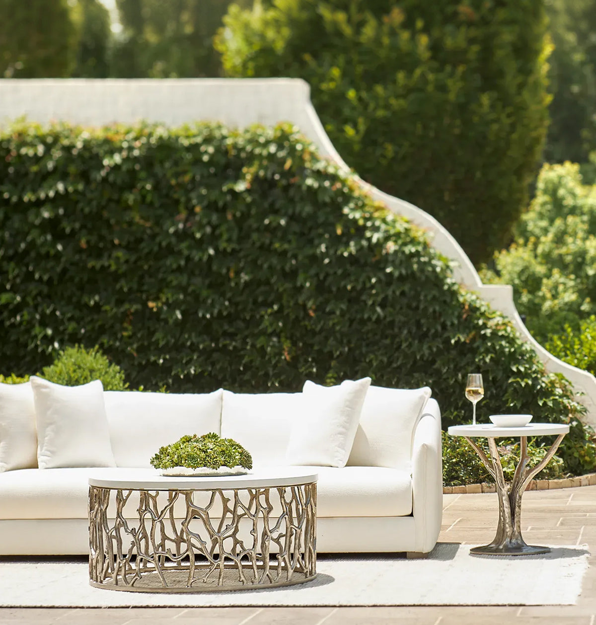 a white couch and a table outside