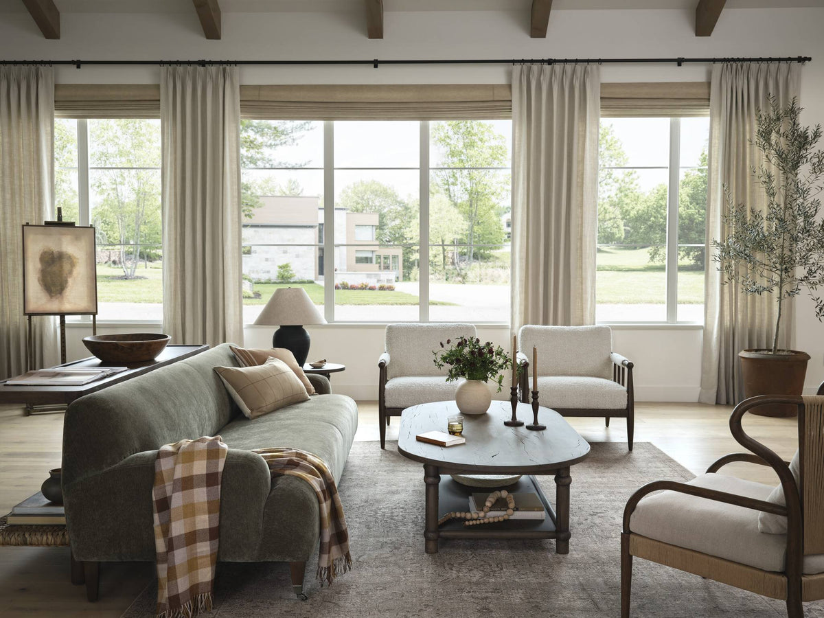 a living room with couches and chairs