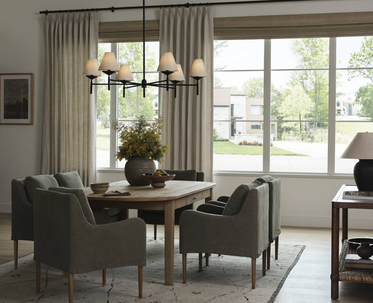 a dining room with a table and chairs