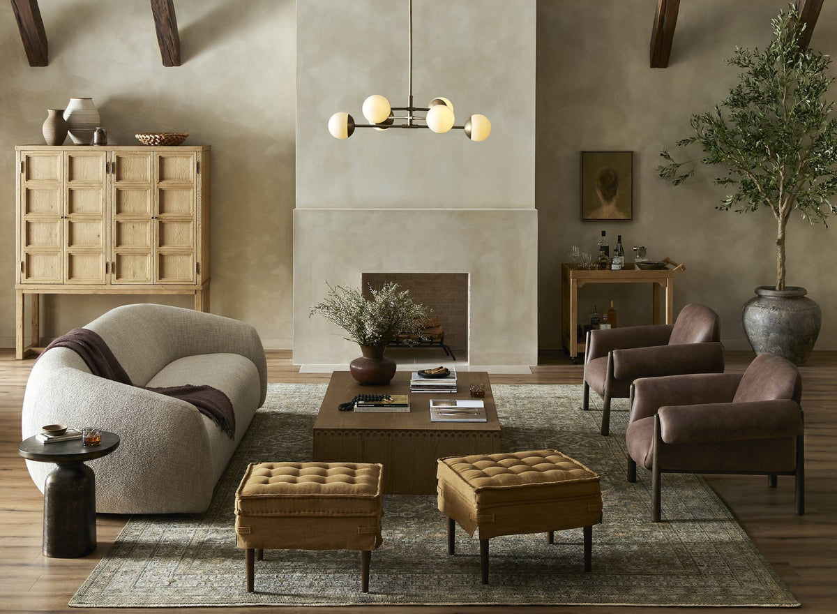 a living room with a fireplace and couches