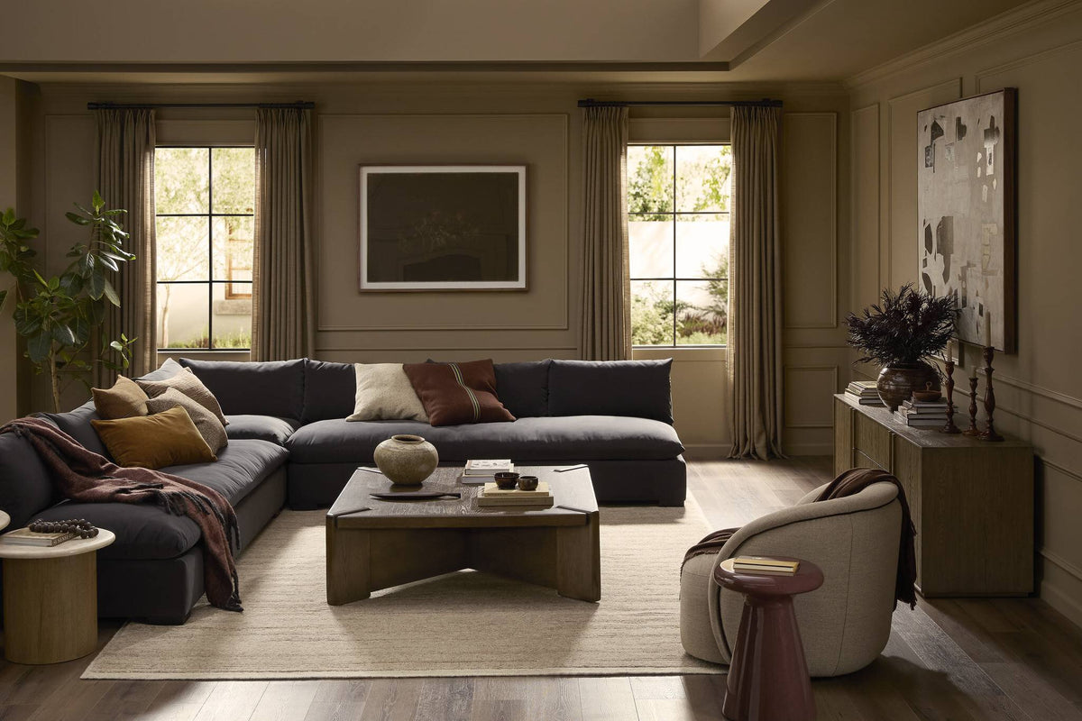 a living room with a large couch and a coffee table
