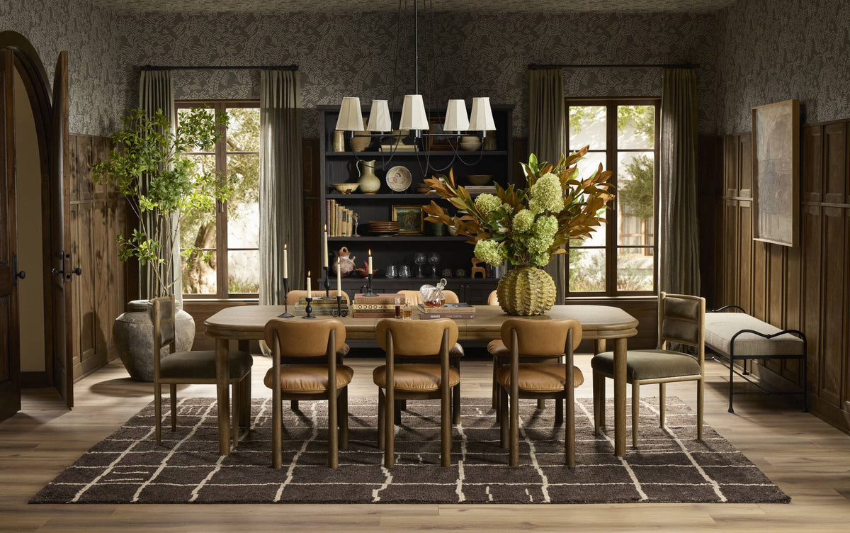 a dining room with a table and chairs