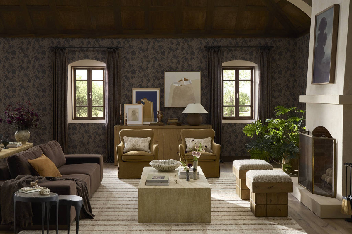 a living room with a couch and chairs