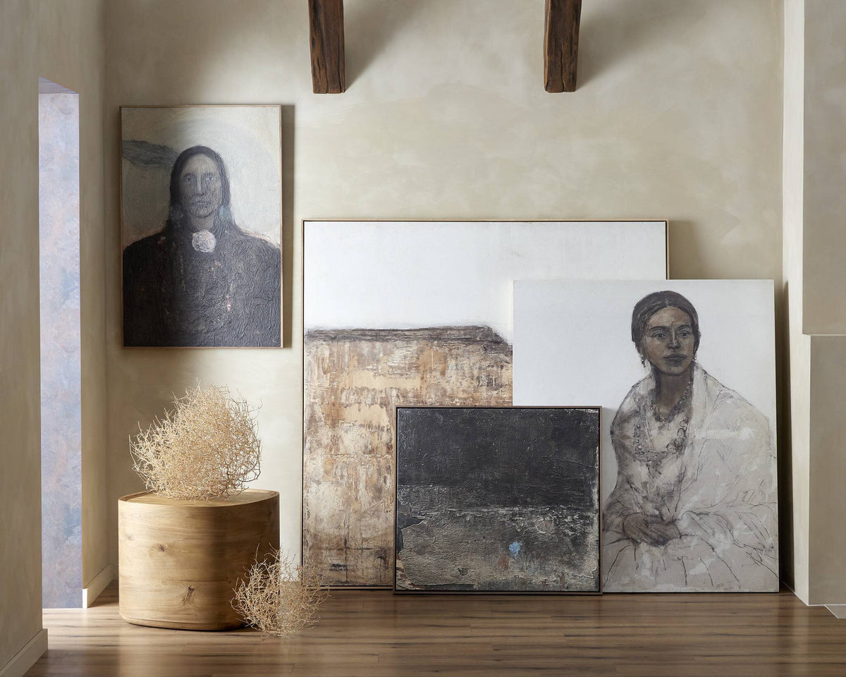 a group of paintings on a wall