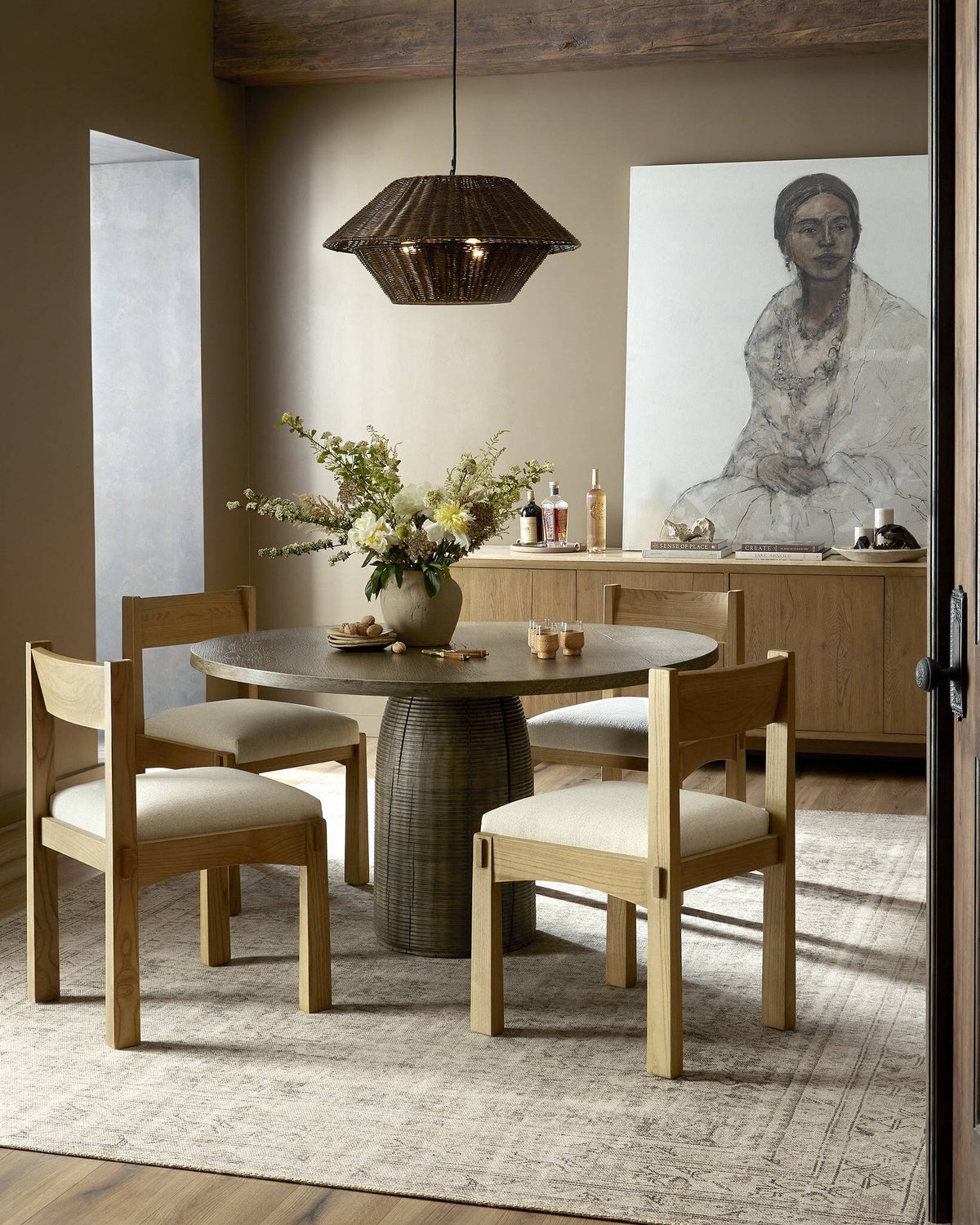 a dining room with a table and chairs