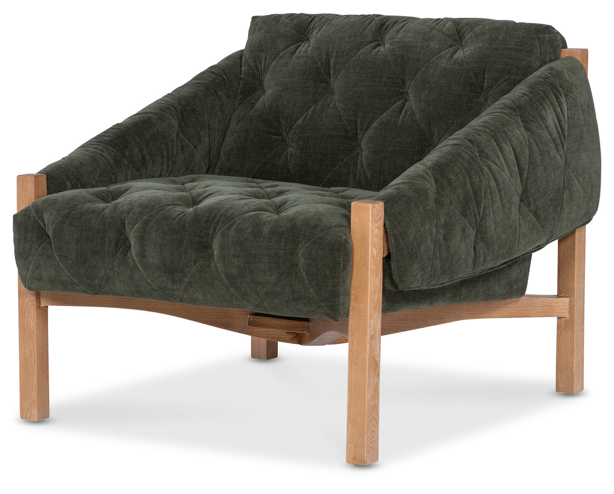 a green chair with wooden legs