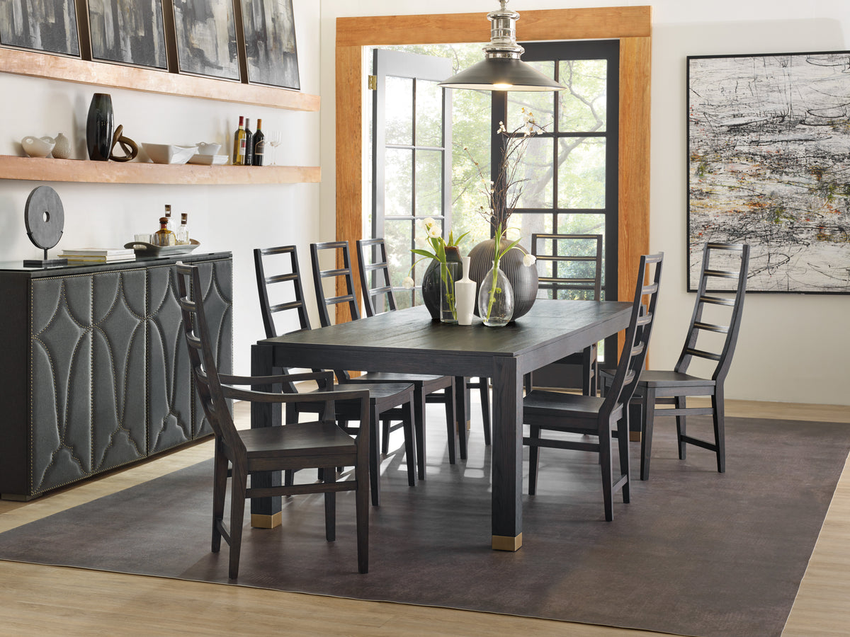 a dining table with chairs in a room