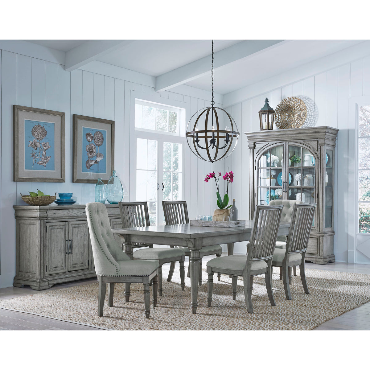 a dining room with a table and chairs