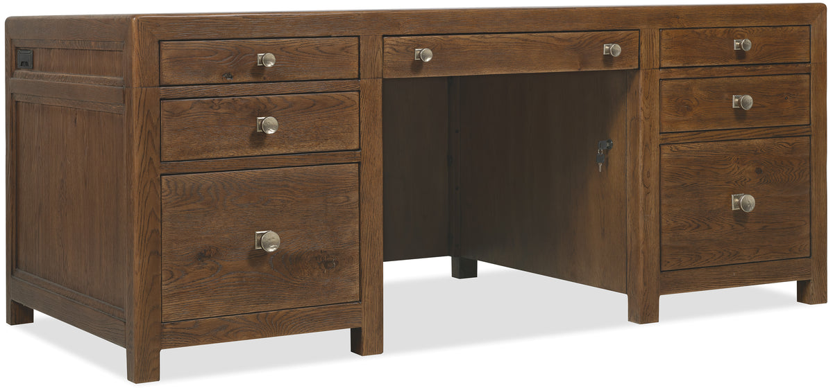 a wooden desk with drawers