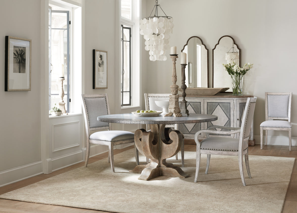a dining room with a table and chairs