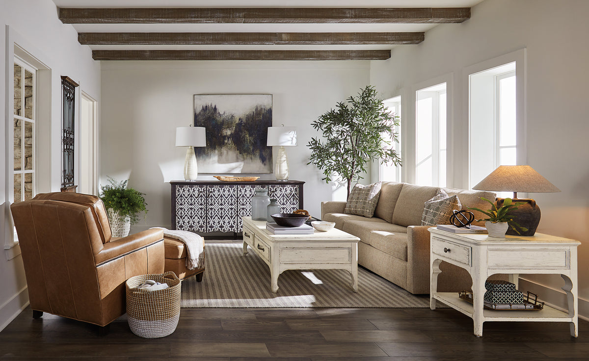 a living room with a couch and a table