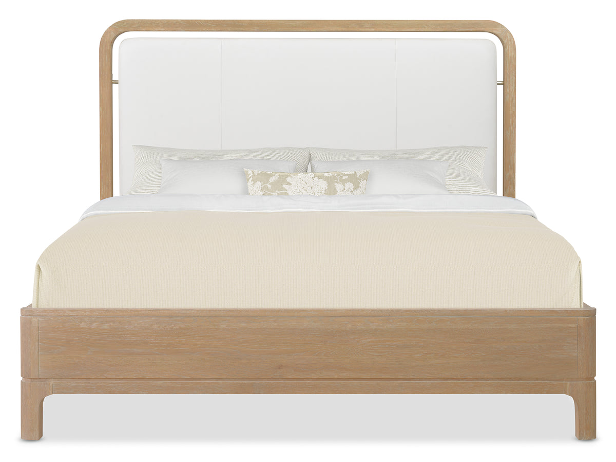 a bed with a white headboard