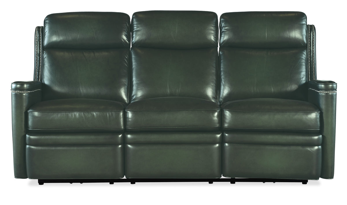 a black leather couch with four reclining seats