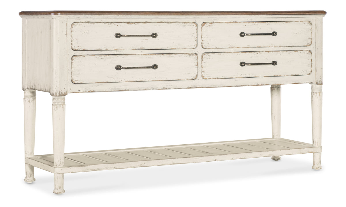 a white dresser with metal handles