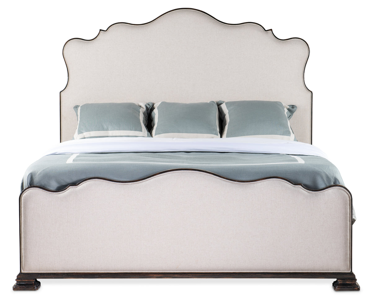 a bed with a white headboard