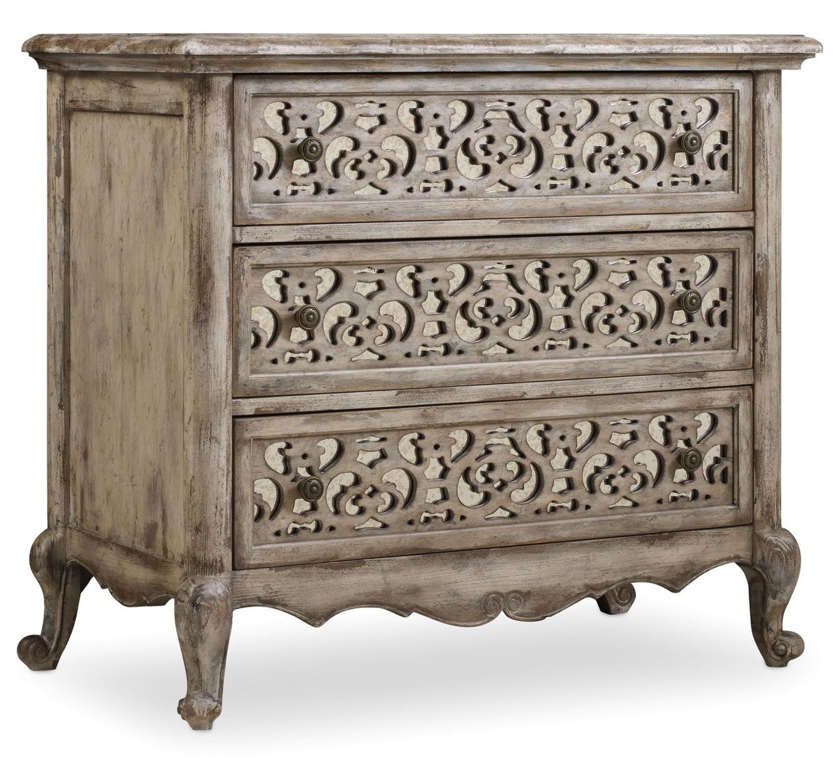a wooden dresser with carved designs