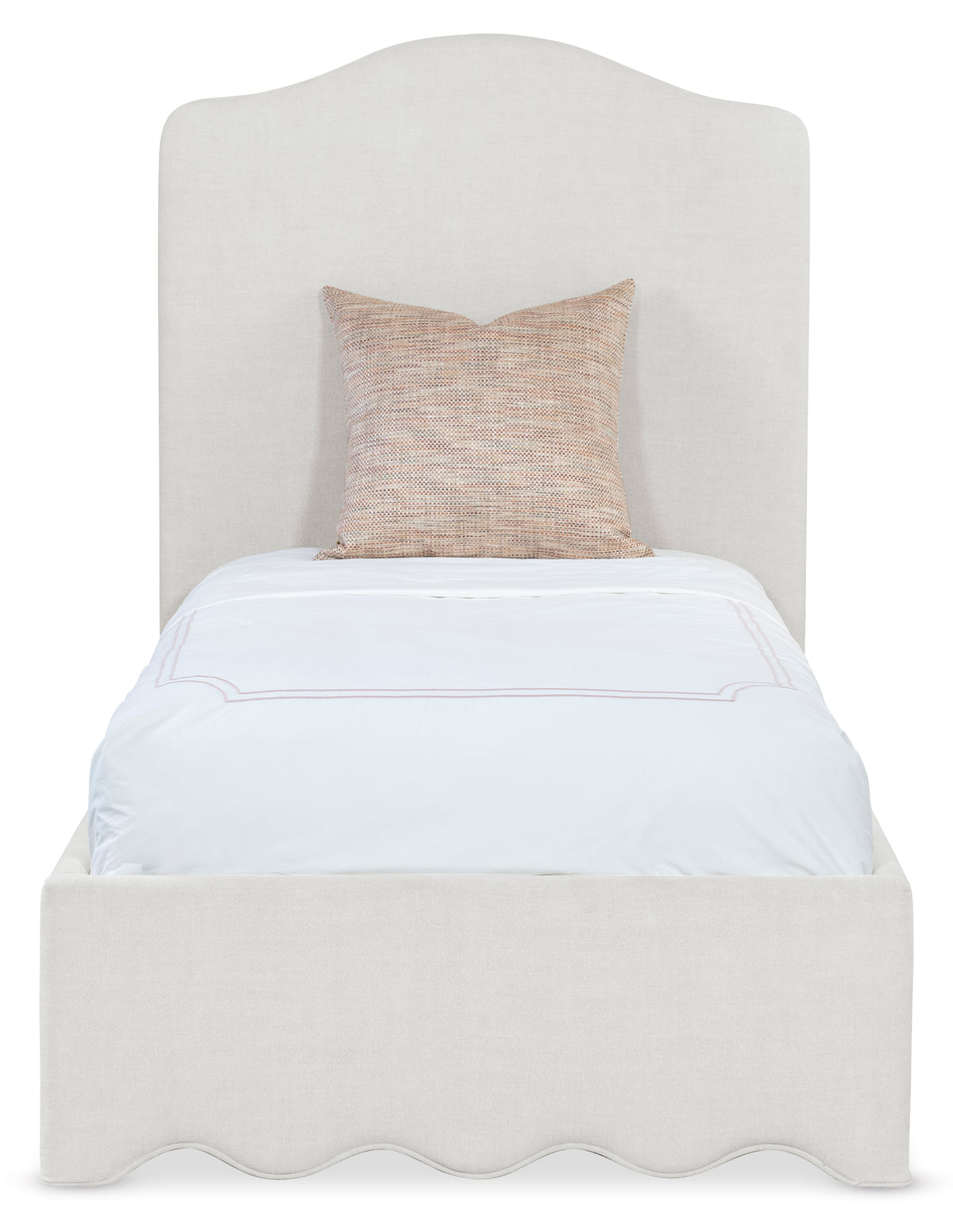 a white bed with a pillow