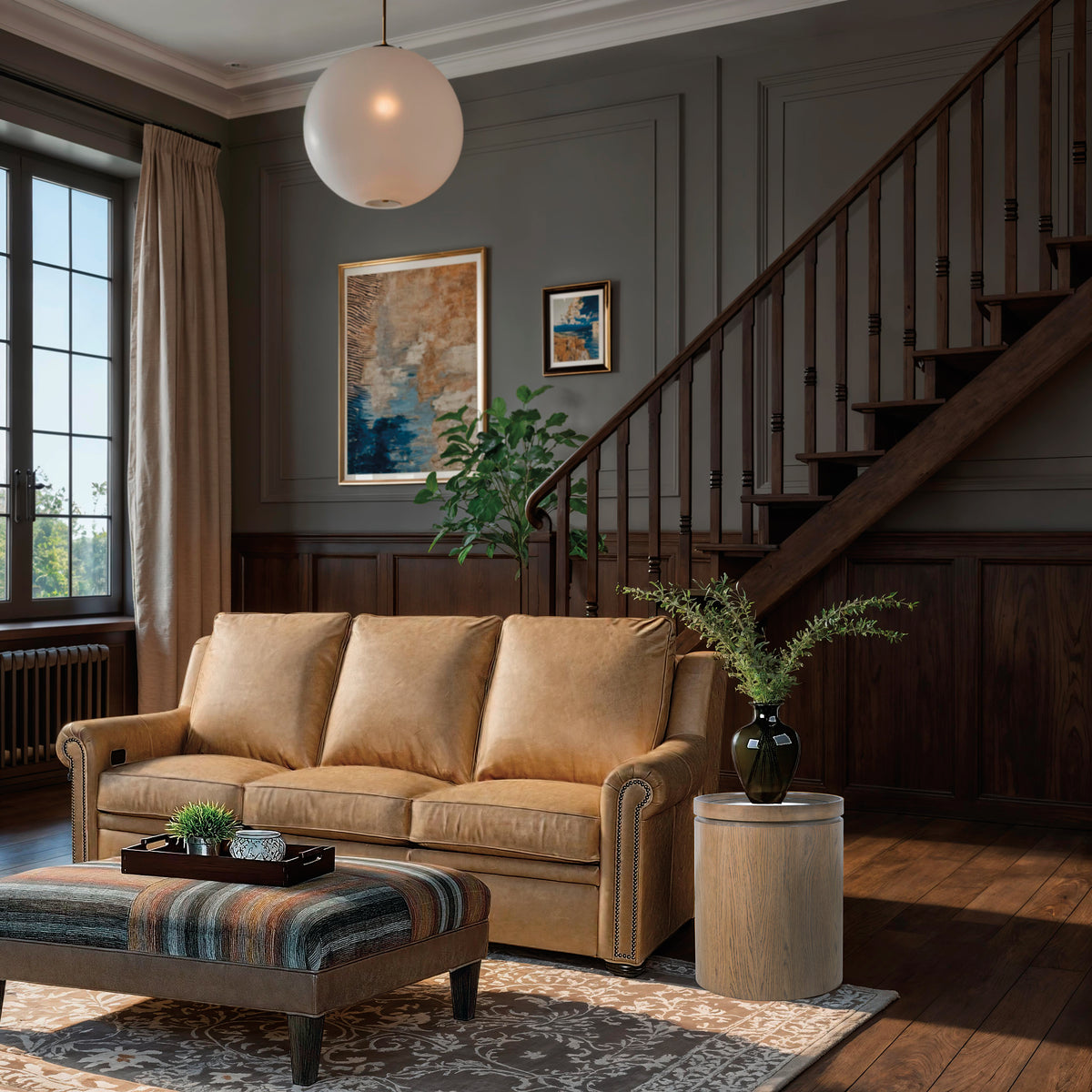 a living room with a couch and a staircase