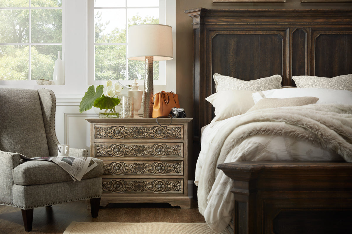 a bedroom with a bed and a lamp