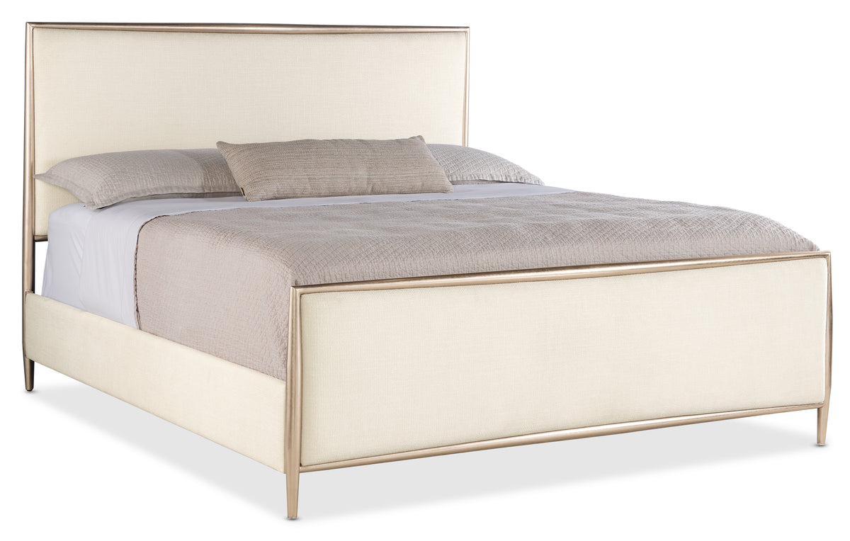 a bed with a white headboard