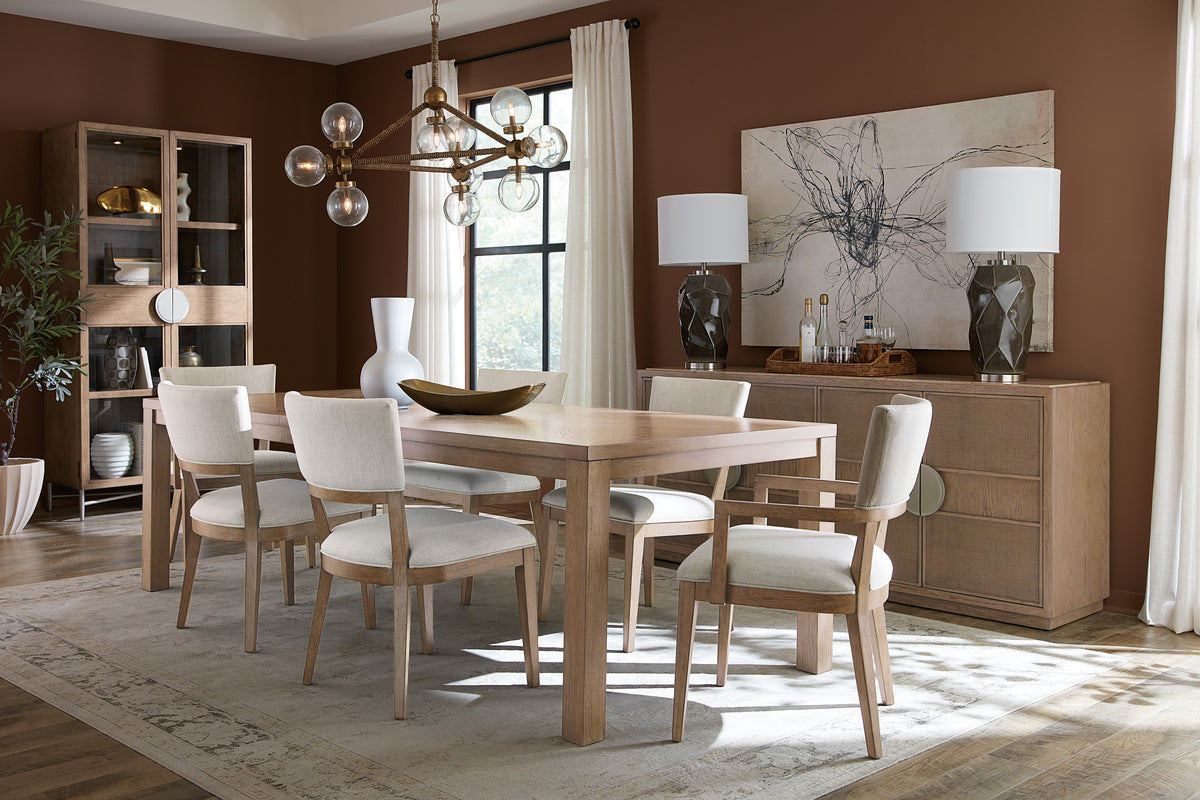 a dining room with a table and chairs