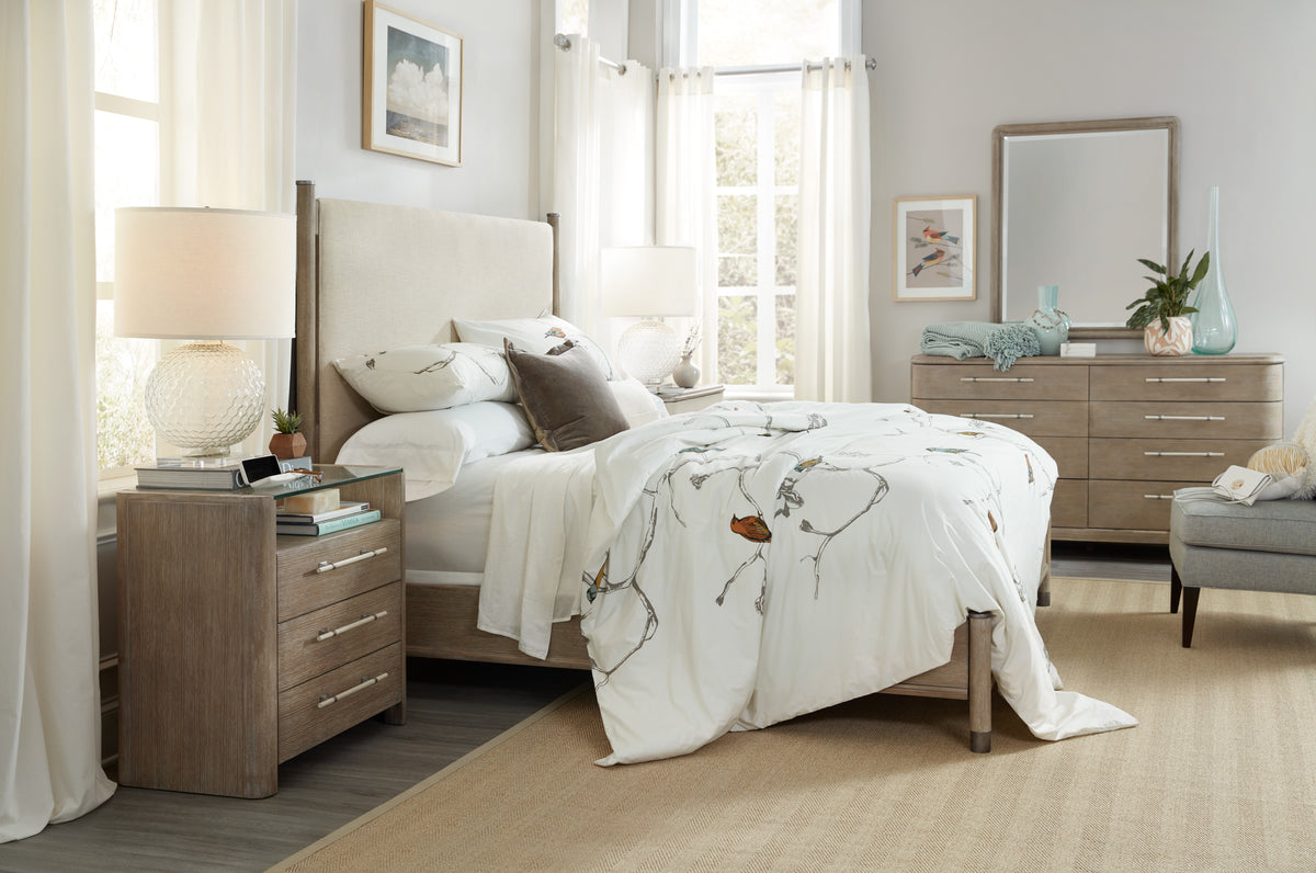 a bedroom with a bed and dresser