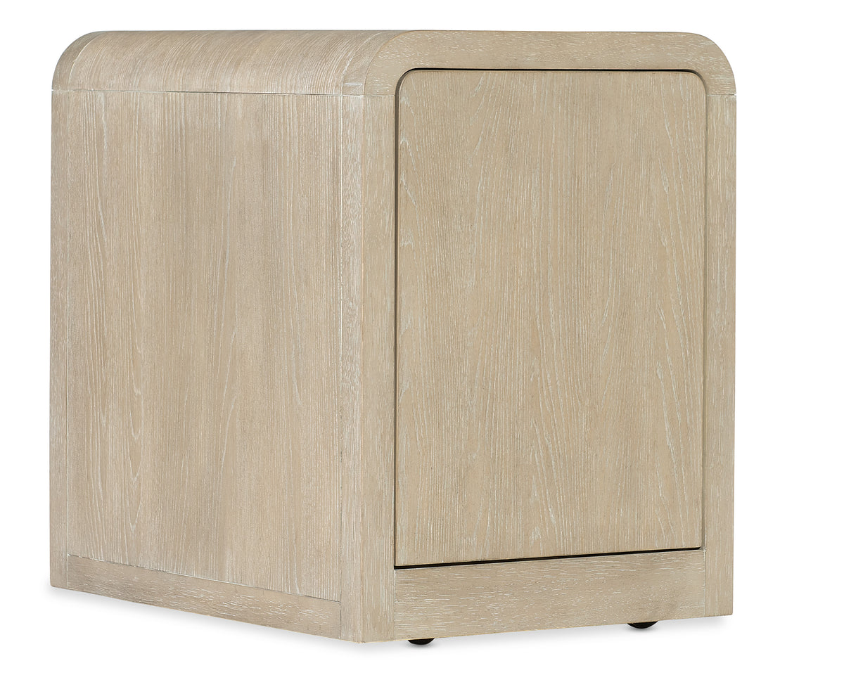 a white wooden box with a door