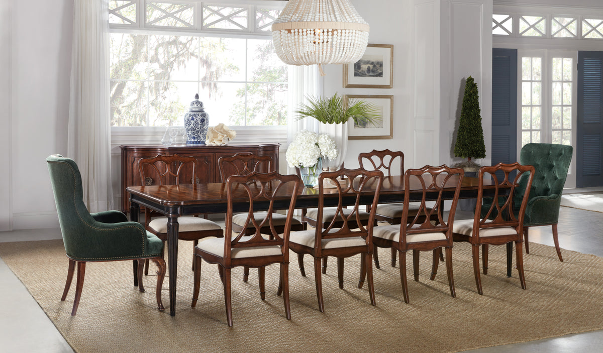 a dining room with a table and chairs