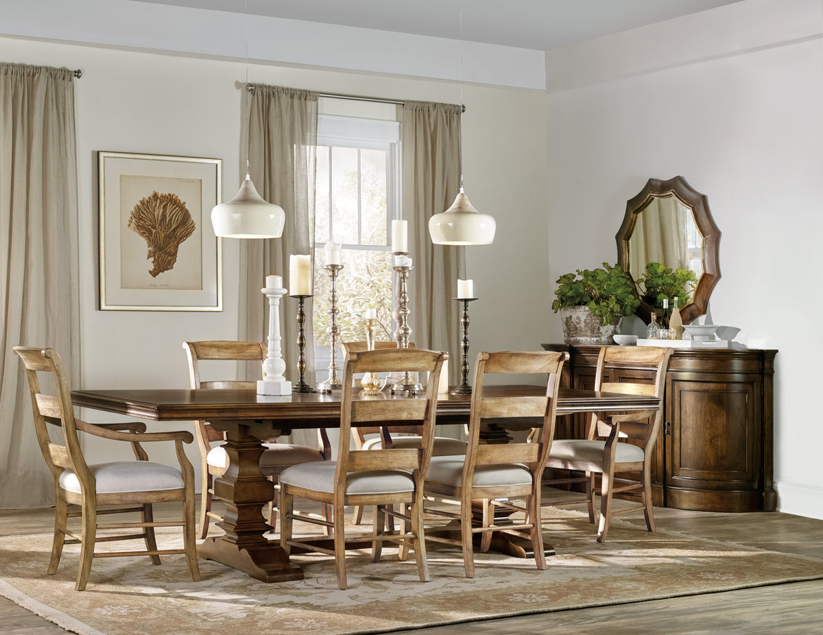 a dining room with a table and chairs
