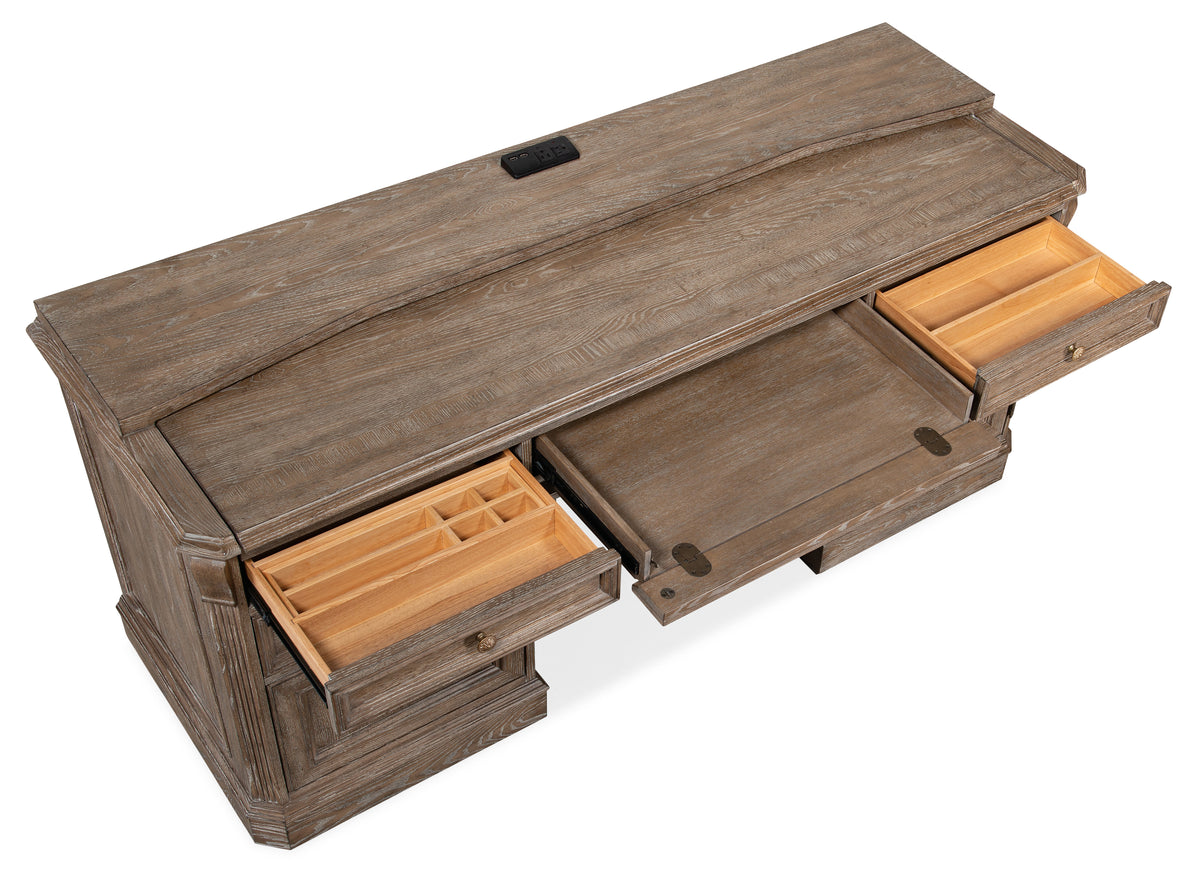 a brown desk with open drawers