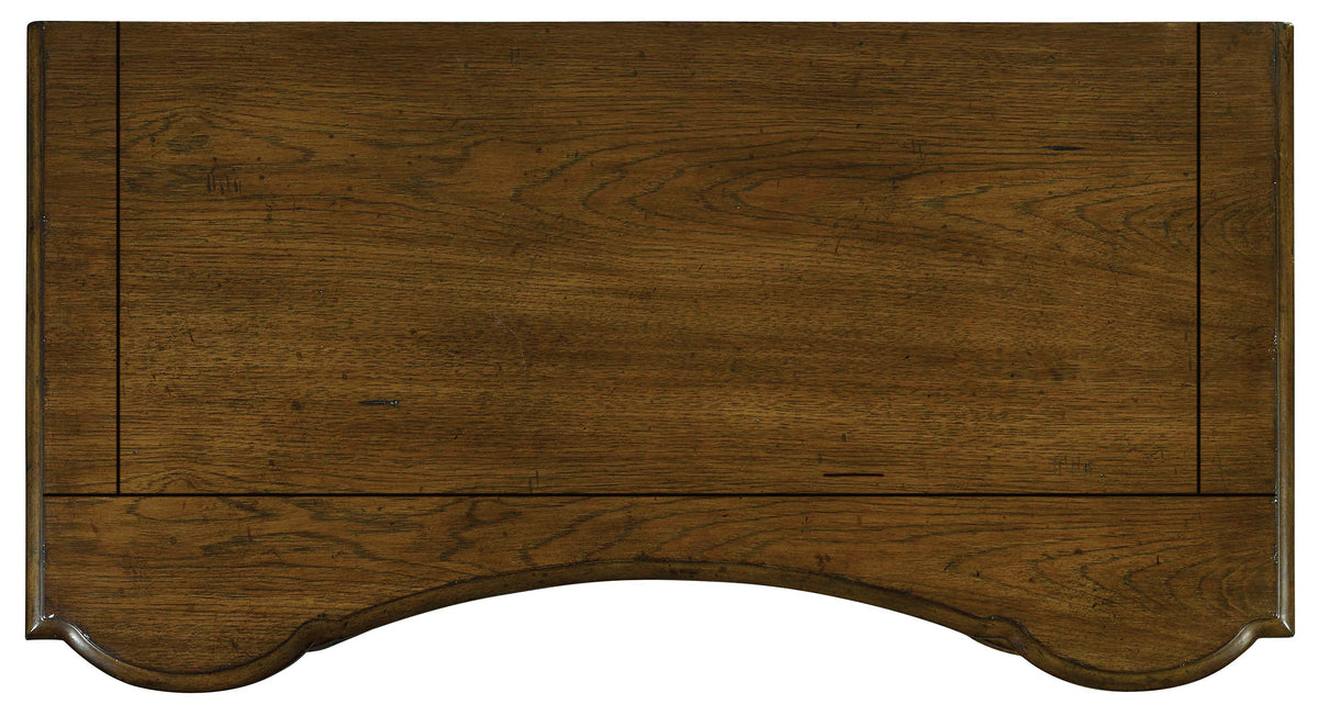a wooden table with a curved edge