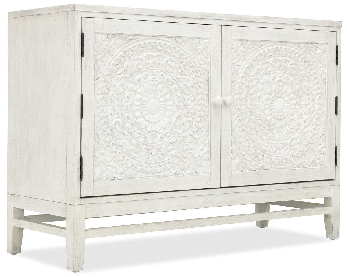 a white cabinet with a design on it