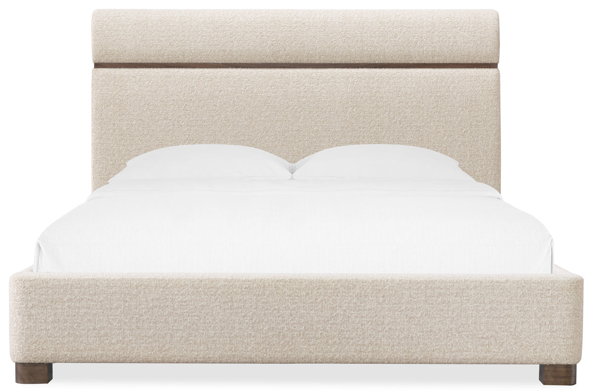 a bed with a white headboard
