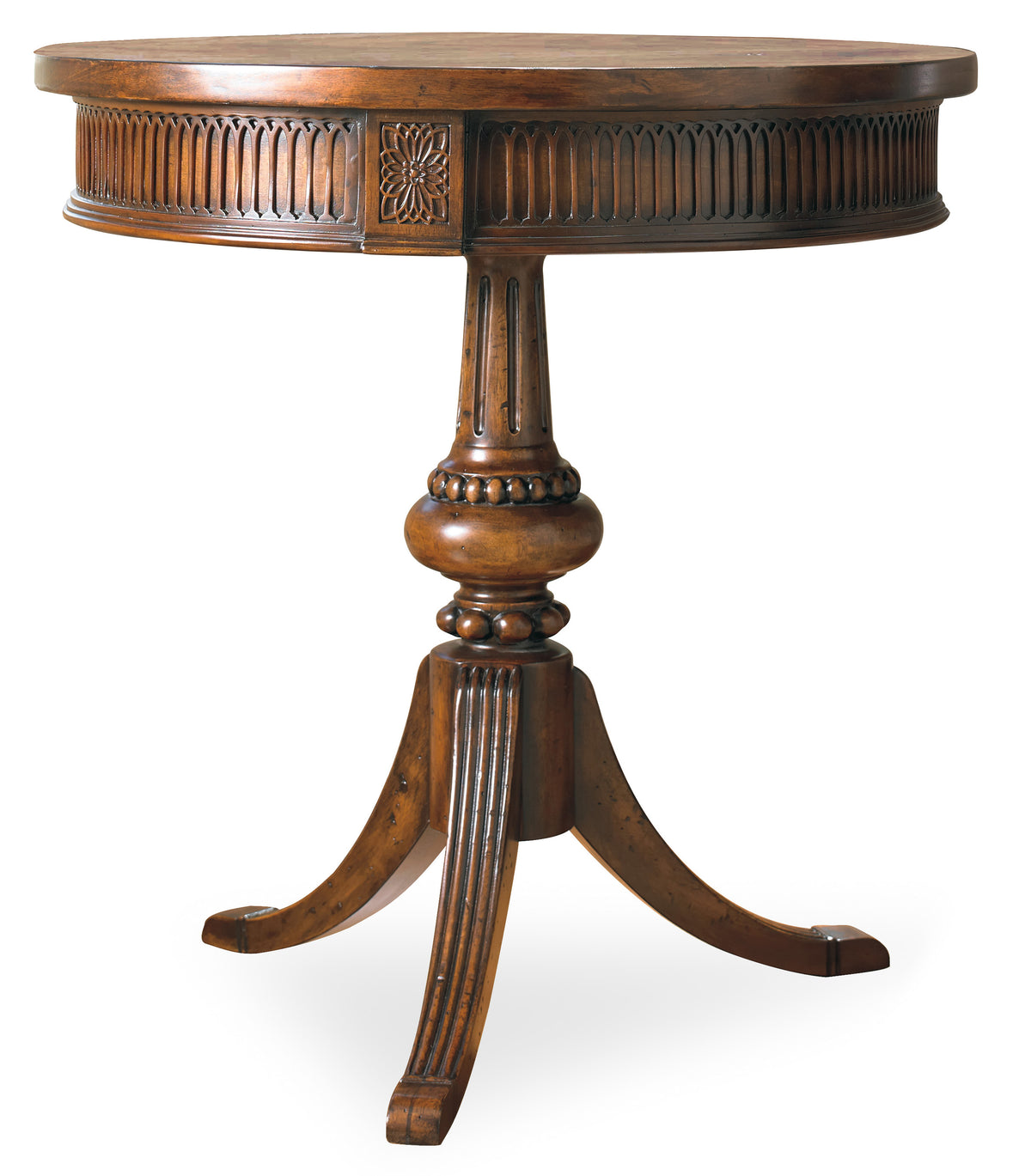 a round wooden table with a carved design
