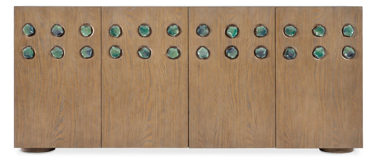 a wooden board with green stones