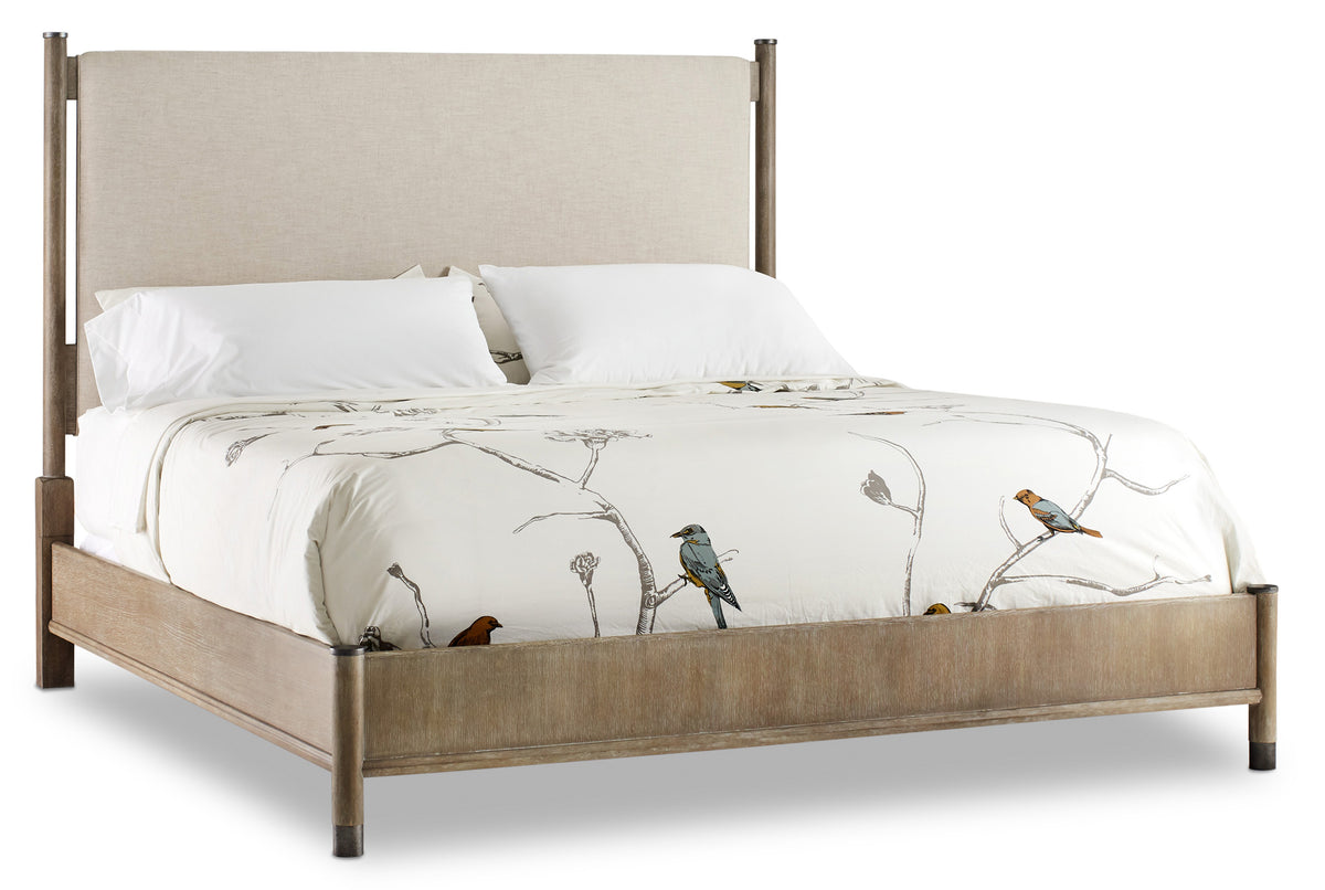 a bed with white sheets and birds on it
