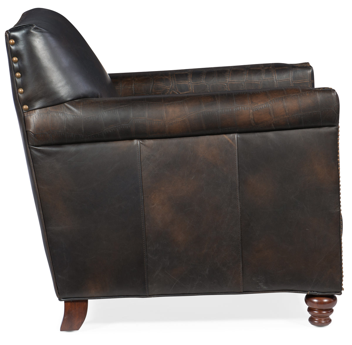 a leather chair with a pillow