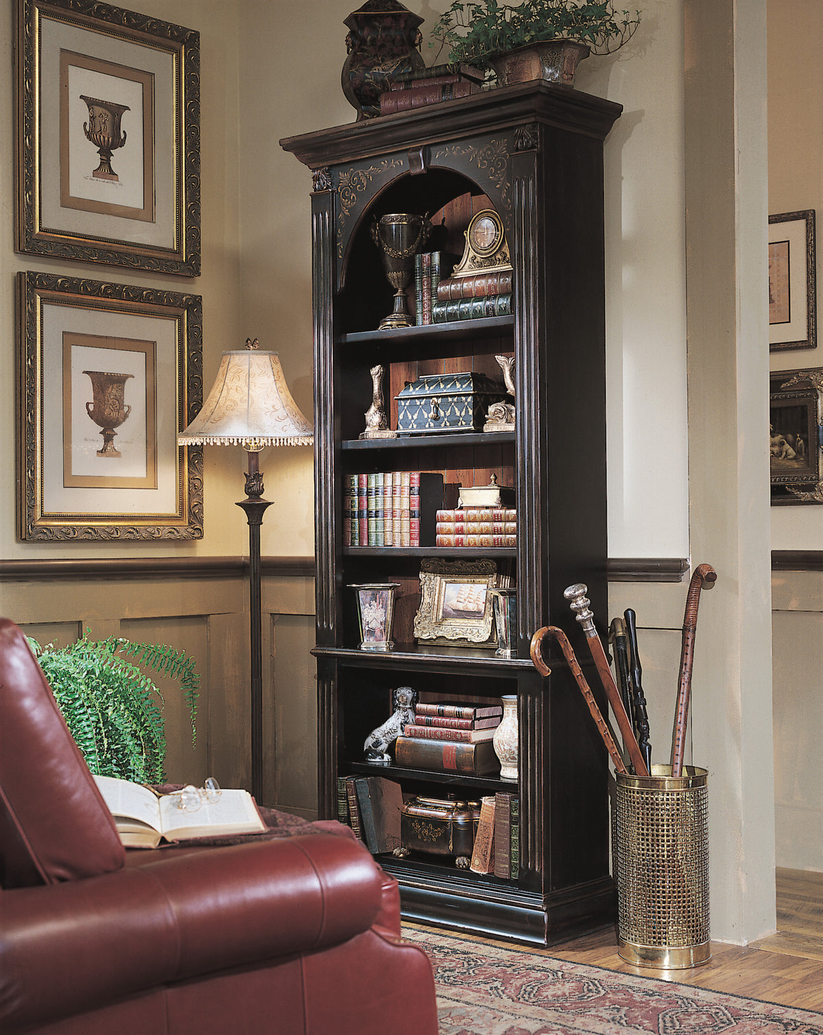 a bookcase with books and objects on it