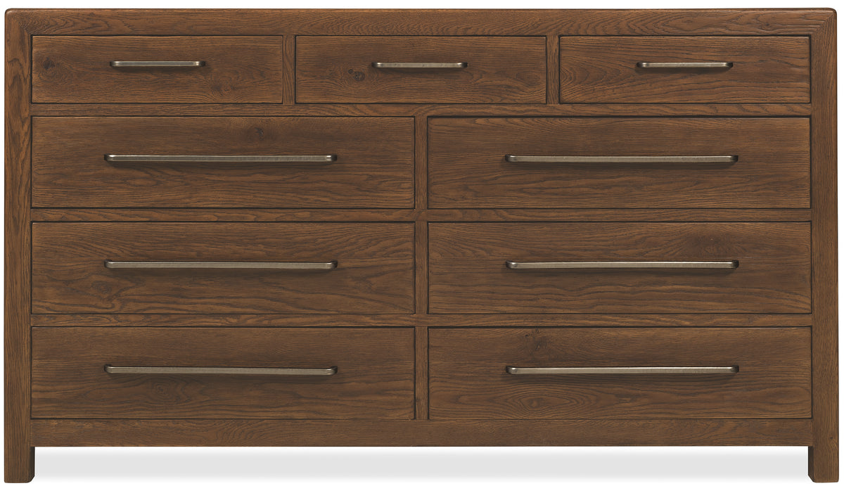 a wooden dresser with silver handles