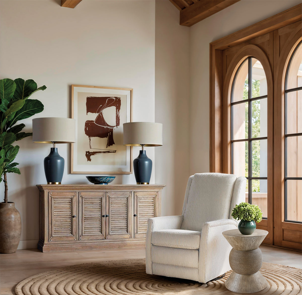 a room with a chair and a table and lamp