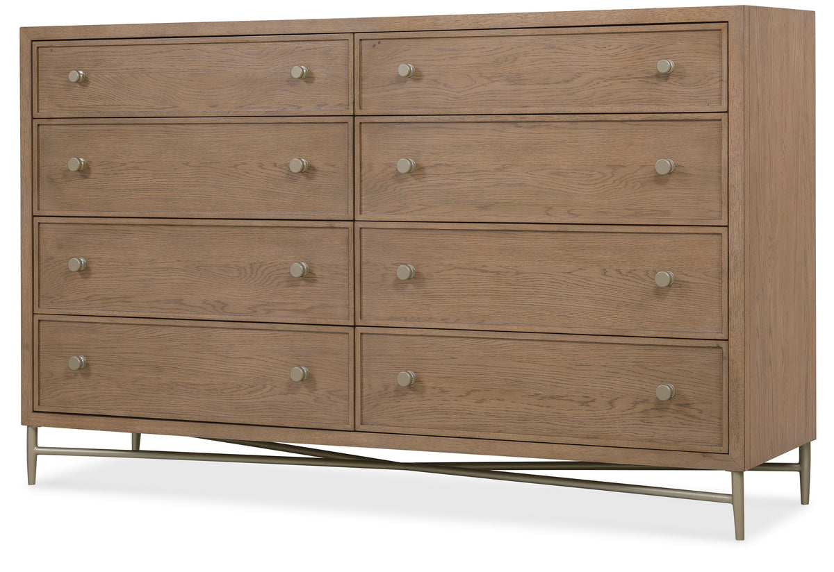 a wooden dresser with silver handles