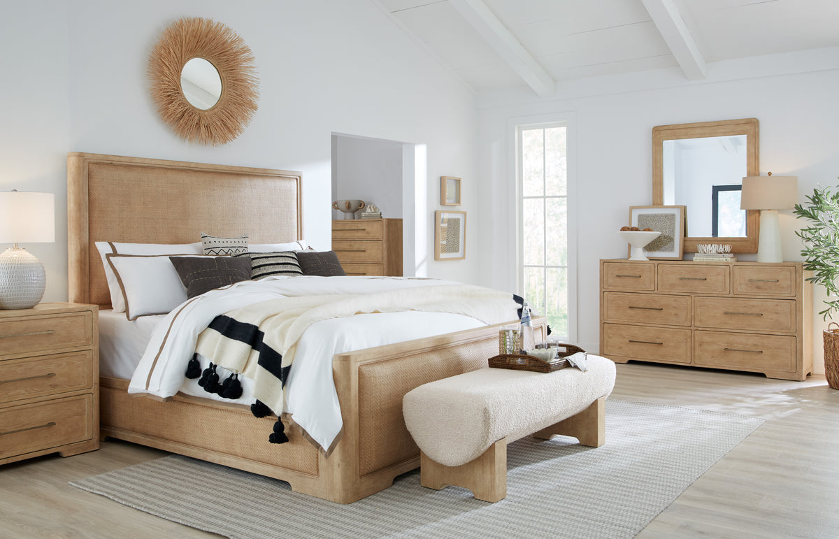 a bedroom with a bed and a bench